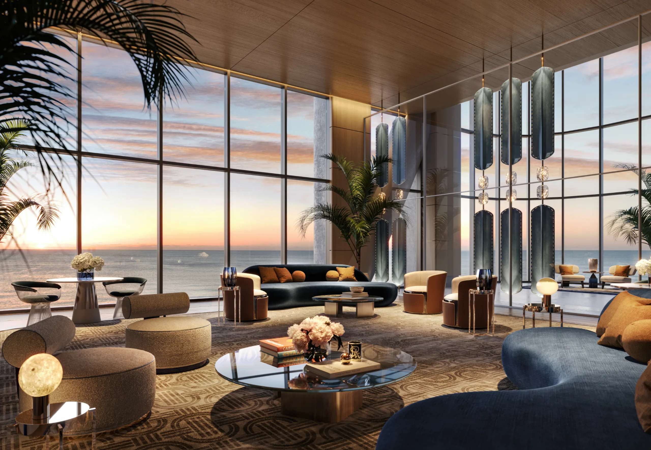 Interior of a modern living room with large floor-to-ceiling windows overlooking the ocean at sunset, decorated with contemporary furniture and plants