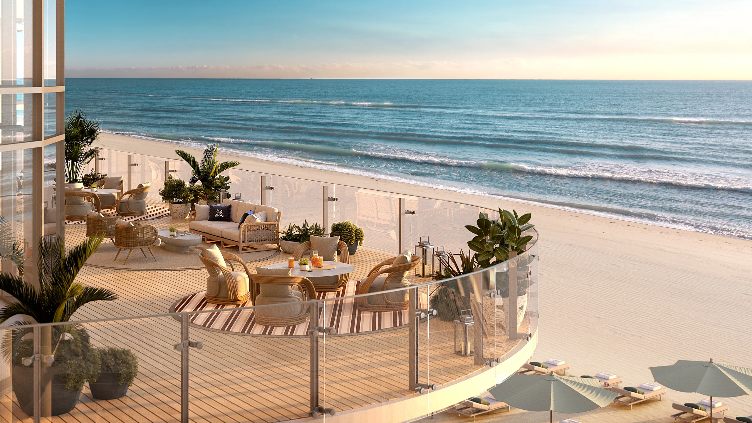 Oceanfront terrace with lounge seating overlooking the beach