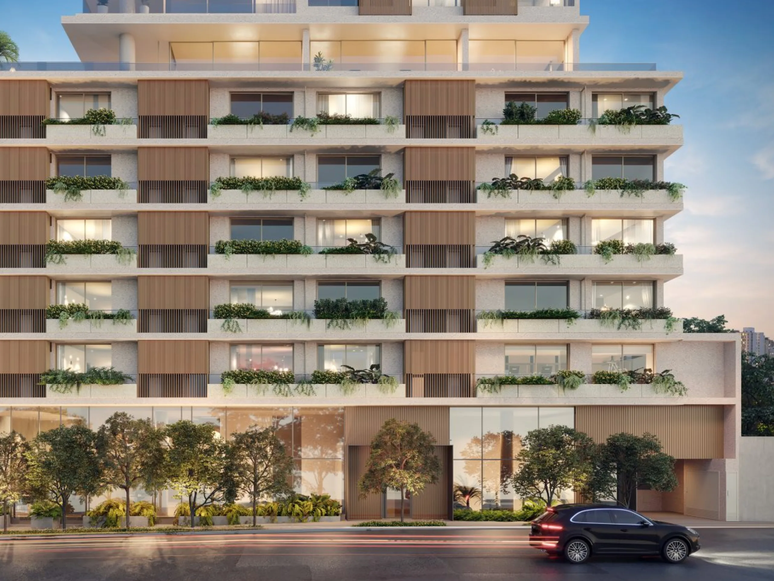 Modern multi-story residential building with balconies and greenery