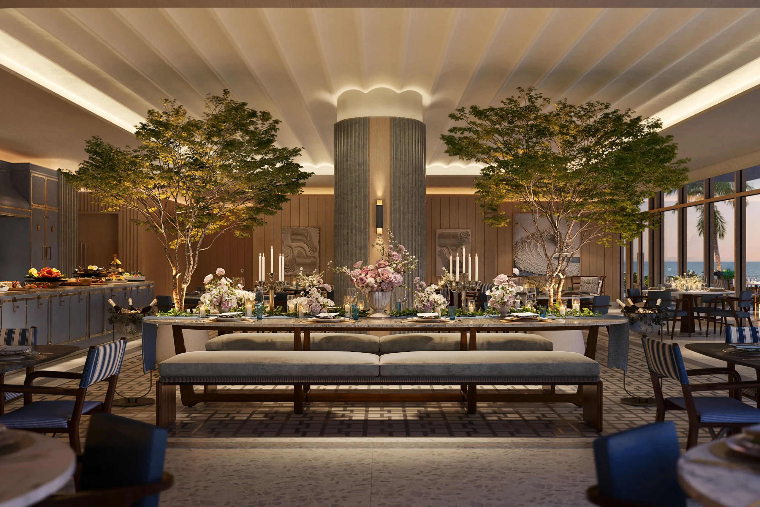 Indoor dining space with large trees, floral arrangements, and candlelit tables