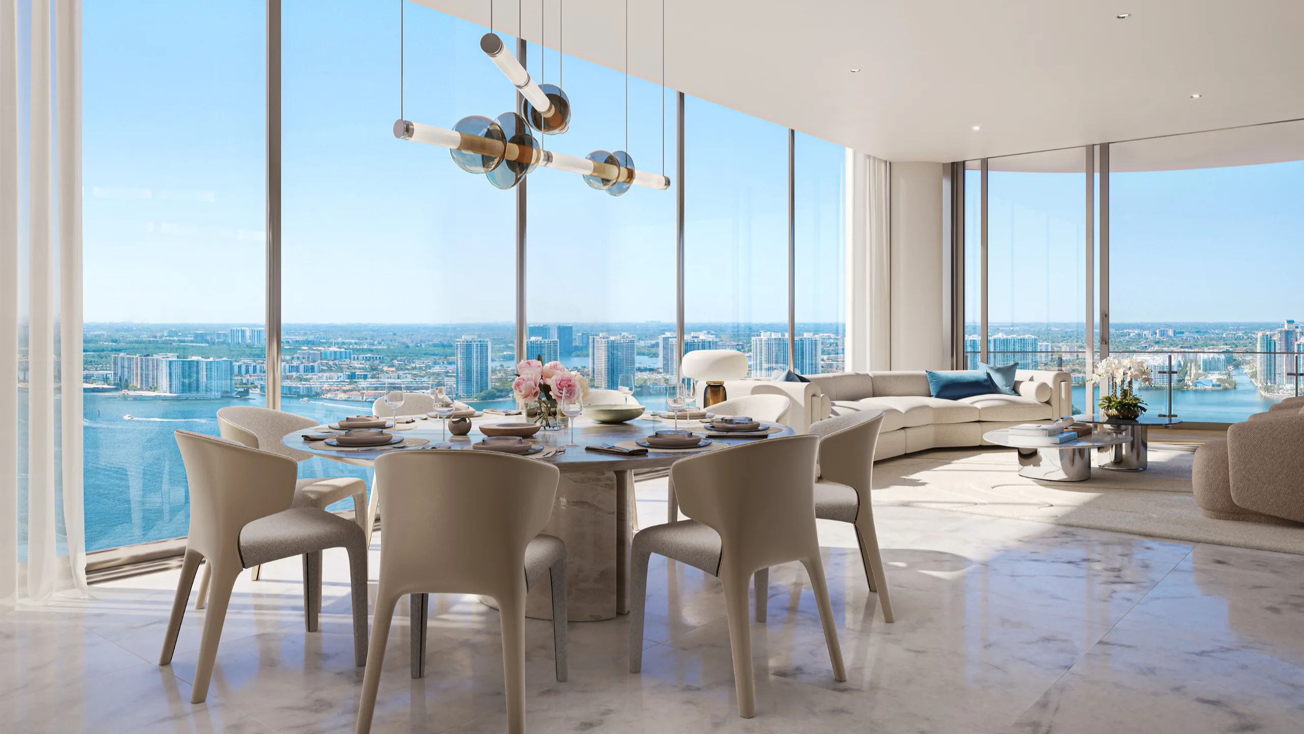 Modern living room with large floor-to-ceiling windows showing city skyline and water