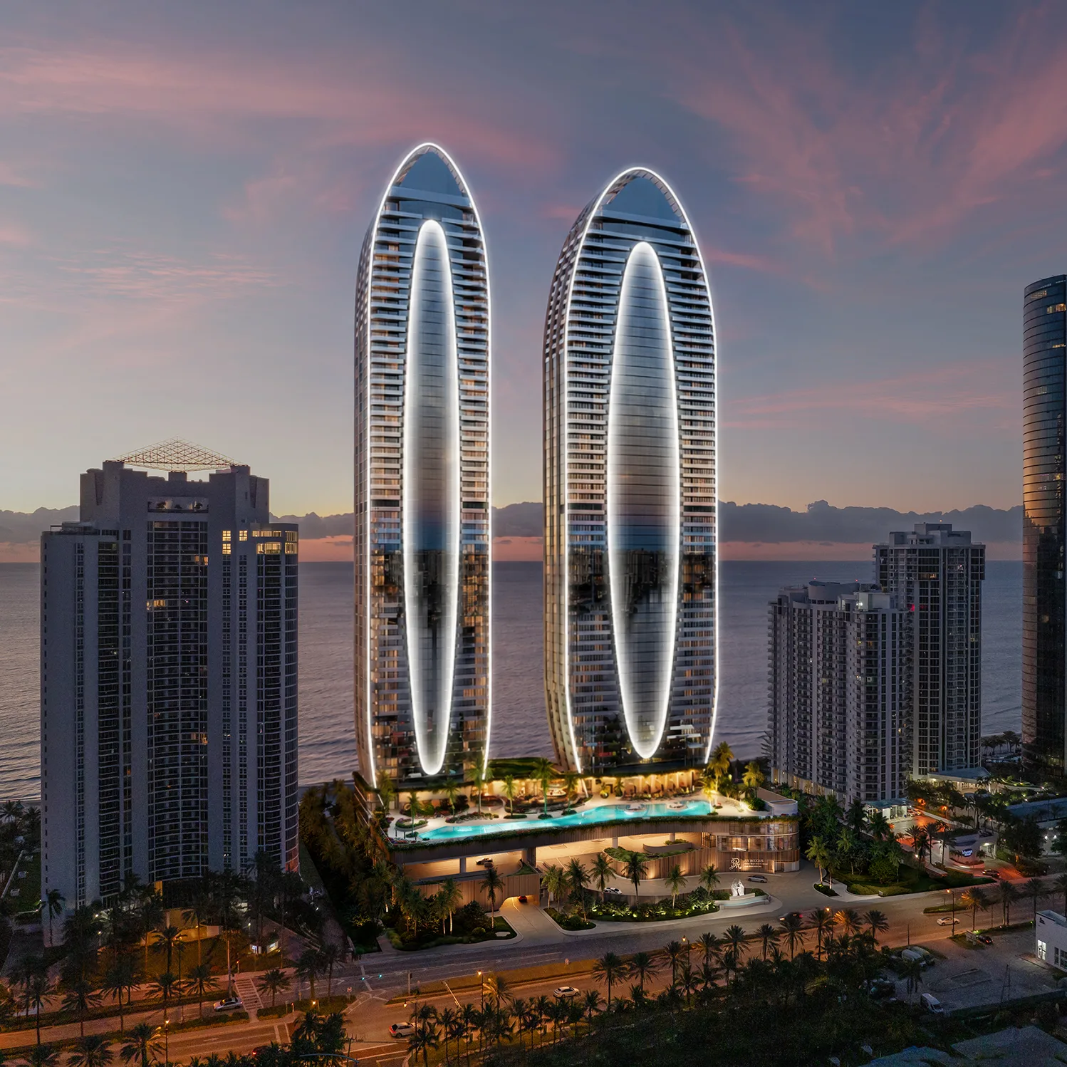 Two modern skyscrapers with illuminated outlines and a pool area at the base, overlooking the ocean at sunset
